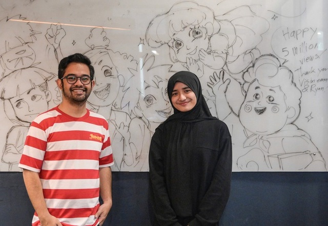 This photo taken on April 21 shows Ryan Adriandhy Halim (left), director of the animated film Jumbo, and illustrator Nadeen Muskita  posing during an interview in Jakarta (AFP photo)